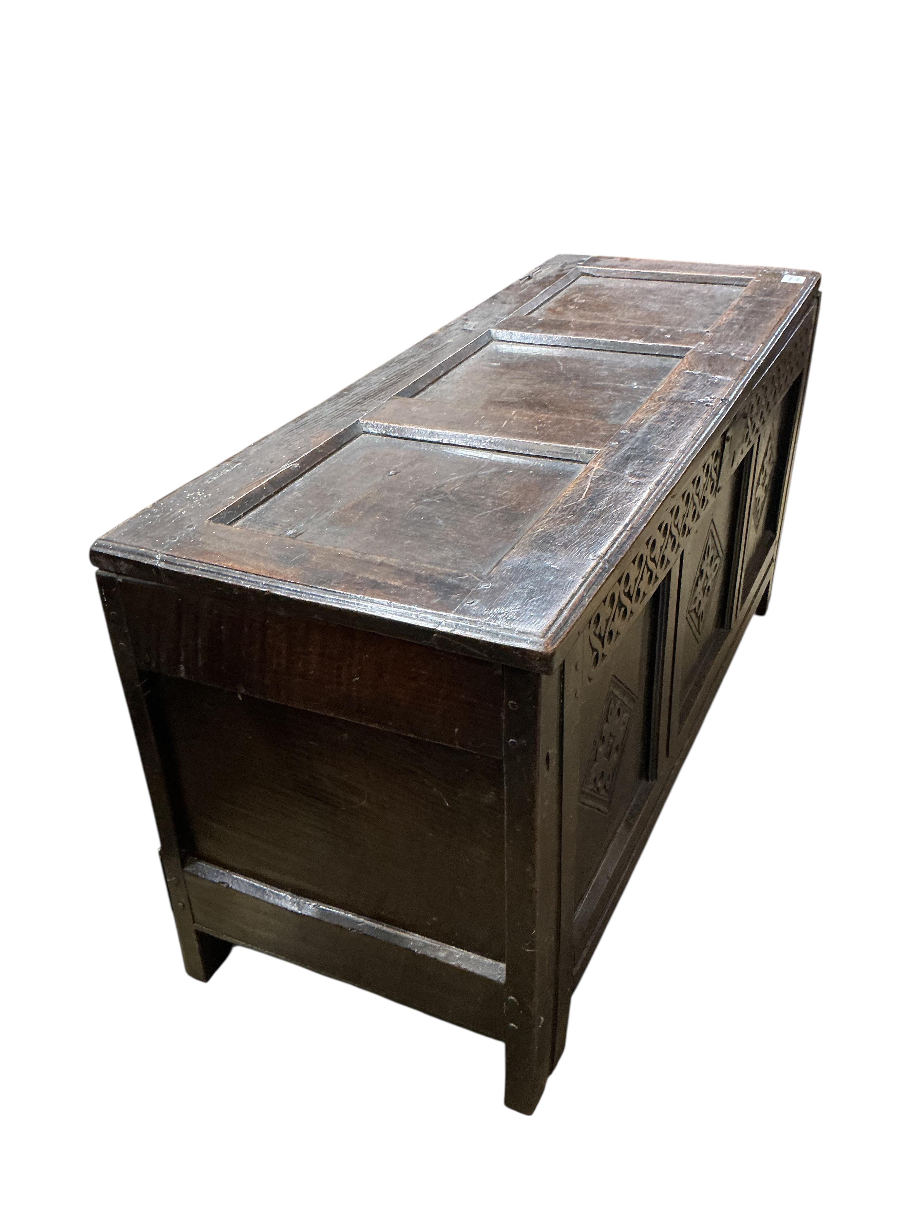A late 17th century oak triple panelled coffer, width 116cm, depth 44cm, height 58cm